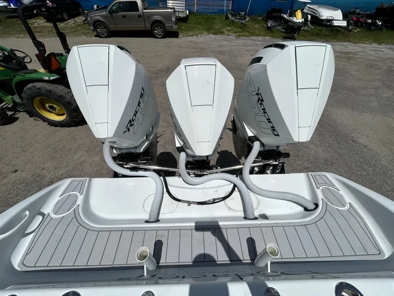 Slide: The Image of 2019 Yellowfin 36 Offshore boat with triple Racing 450 engines, parked on a lot. - 26