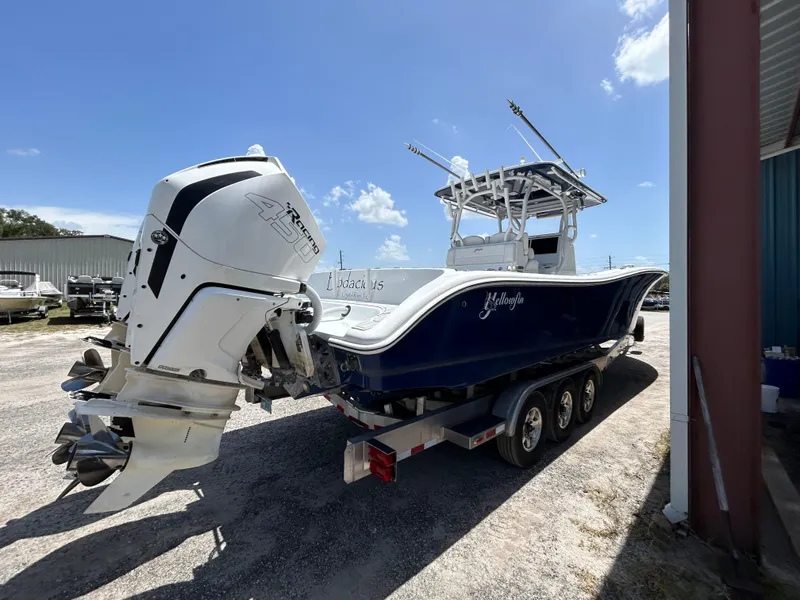 Slide: The Image of 2019 Yellowfin 36 Offshore boat on trailer with powerful outboard engine. - 5