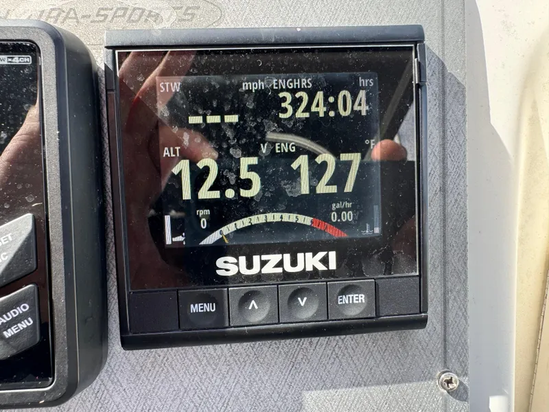 Slide: The Image of Suzuki engine display on 2005 Hydra-Sports Lightning 230 WA boat dashboard. - 13