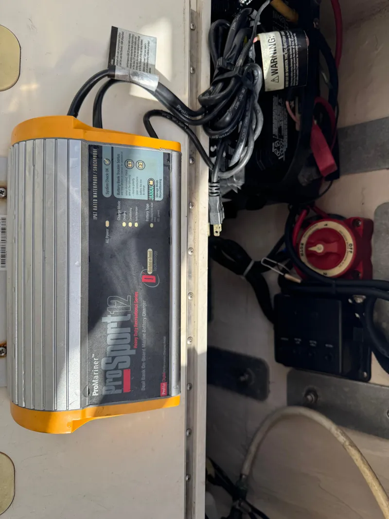 Slide: The Image of Battery charger setup in a 2005 Hydra-Sports Lightning 230 WA boat. - 14