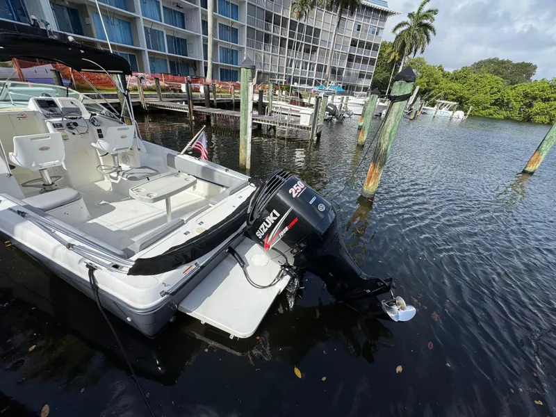 Slide: The Image of 2005 Hydra-Sports Lightning 230 WA boat docked with Suzuki 250 outboard motor. - 4