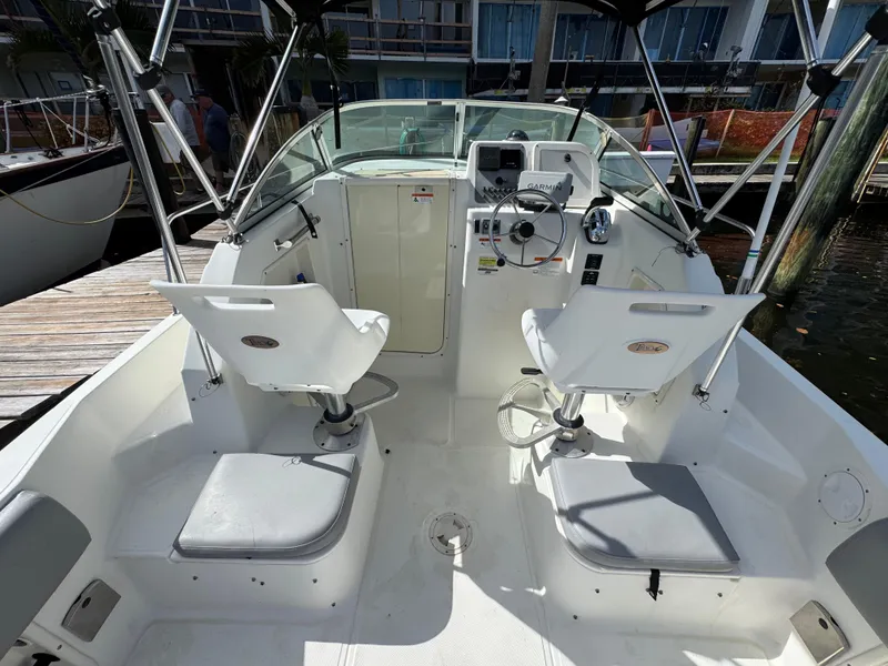 Slide: The Image of 2005 Hydra-Sports Lightning 230 WA boat interior with steering wheel and seating. - 6