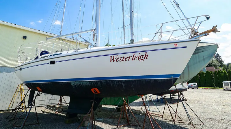 Slide: The Image of 2001 Catalina 36 MkII sailboat named Westerleigh on stands in a boatyard. - 0