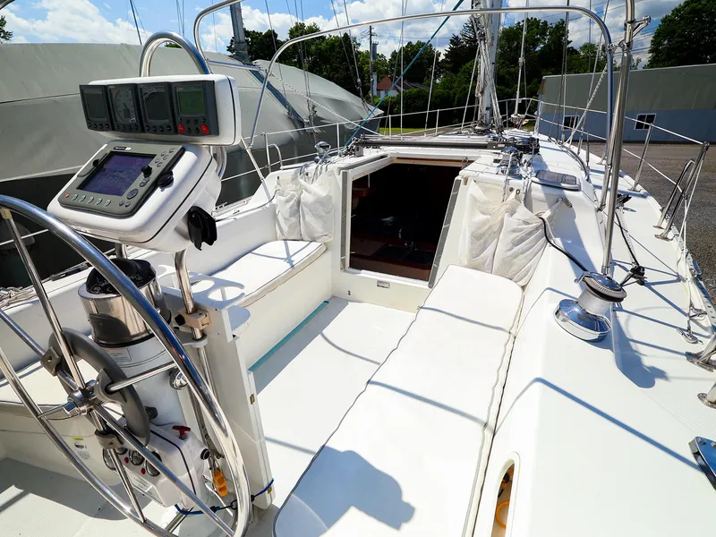 Slide: The Image of 2001 Catalina 36 MkII sailboat cockpit with navigation equipment and seating. - 11