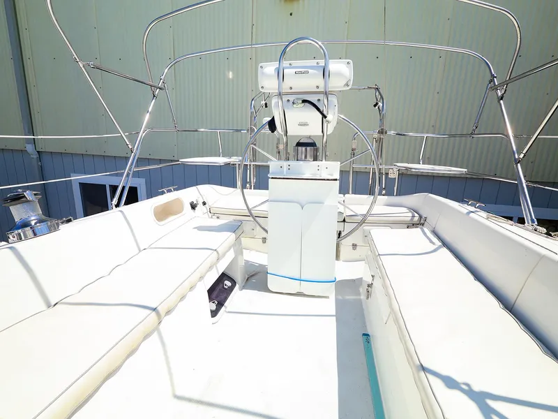 Slide: The Image of 2001 Catalina 36 MkII sailboat cockpit with white seating and steering wheel. - 14