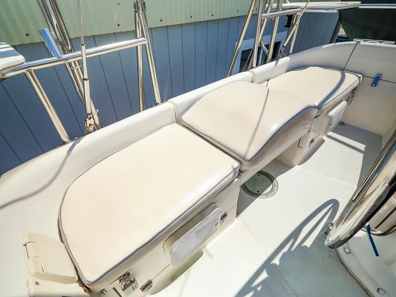 Slide: The Image of 2001 Catalina 36 MkII sailboat cockpit with cushioned seating and stainless steel railings. - 16