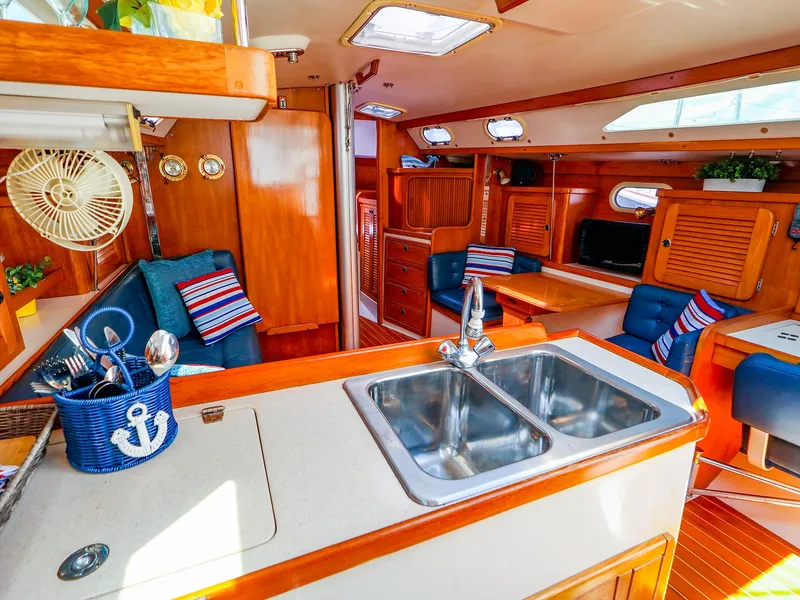 Slide: The Image of Interior of 2001 Catalina 36 MkII sailboat with cozy seating and nautical decor. - 19