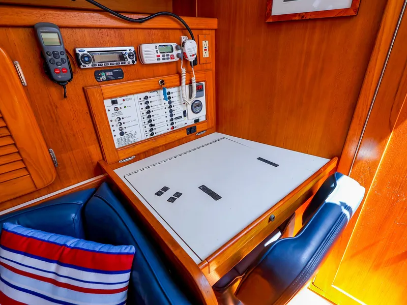 Slide: The Image of Navigation station in 2001 Catalina 36 MkII sailboat with control panel and seating. - 26