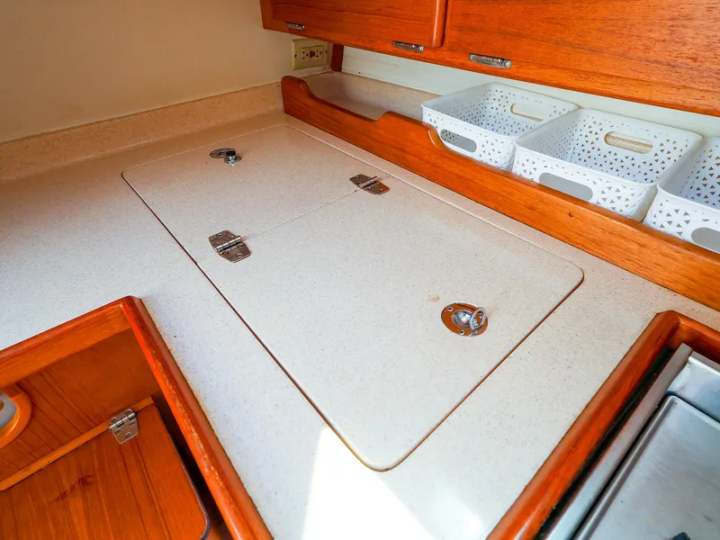 Slide: The Image of Interior of 2001 Catalina 36 MkII sailboat with countertop and storage baskets. - 28