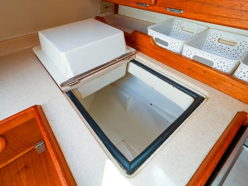 Slide: The Image of Interior of 2001 Catalina 36 MkII sailboat showing galley storage and countertop. - 29