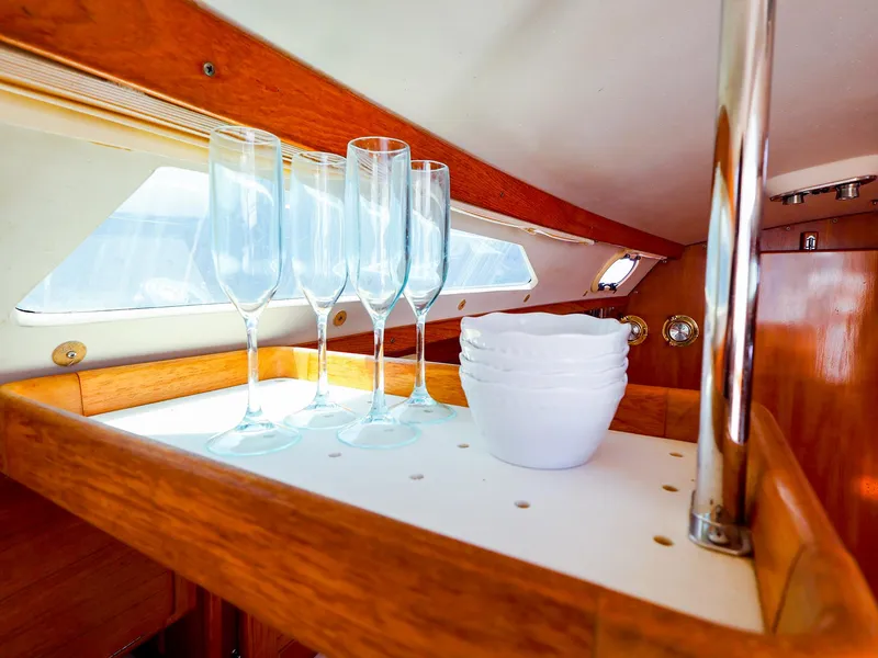 Slide: The Image of Interior of 2001 Catalina 36 MkII yacht with glasses and bowls on wooden shelf. - 30