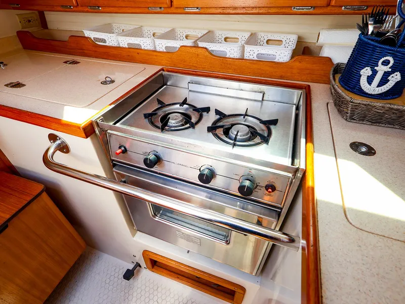 Slide: The Image of Galley kitchen in 2001 Catalina 36 MkII sailboat with stove and storage. - 32