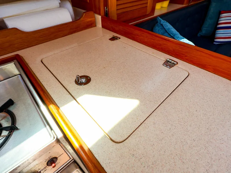 Slide: The Image of Interior of 2001 Catalina 36 MkII sailboat galley with countertop and stove. - 34