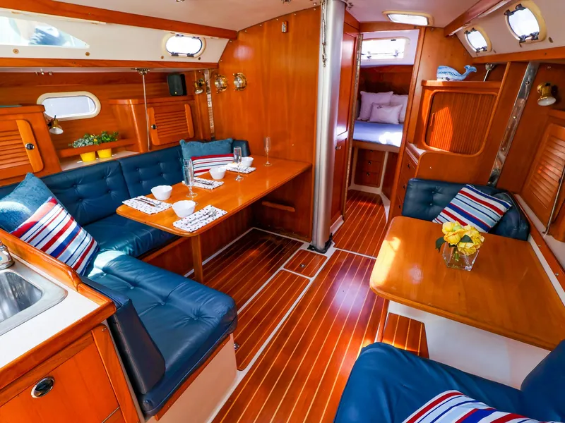 Slide: The Image of Interior of a 2001 Catalina 36 MkII sailboat with cozy seating and wooden finishes. - 37