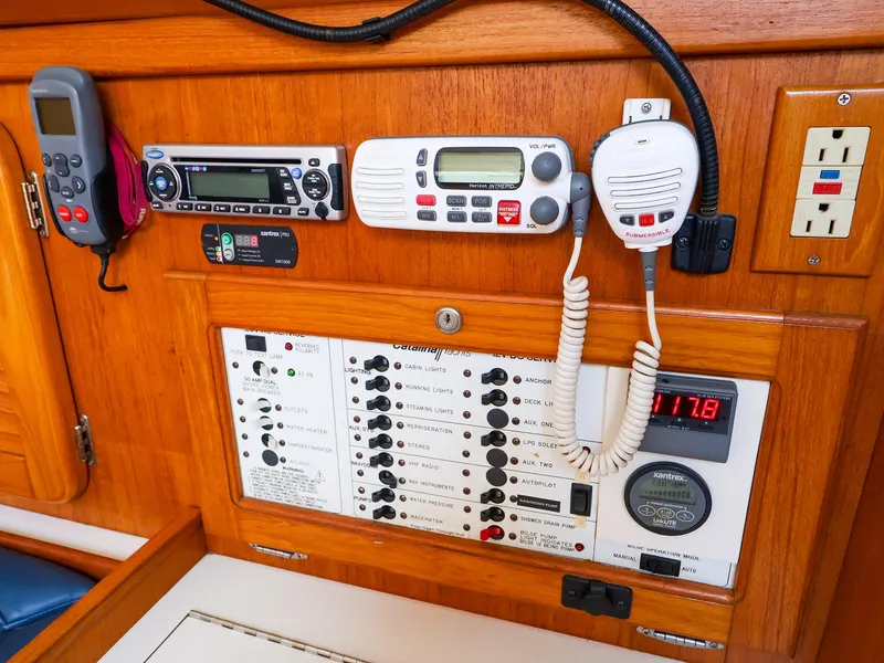 Slide: The Image of Control panel of a 2001 Catalina 36 MkII sailboat with communication and electrical systems. - 39