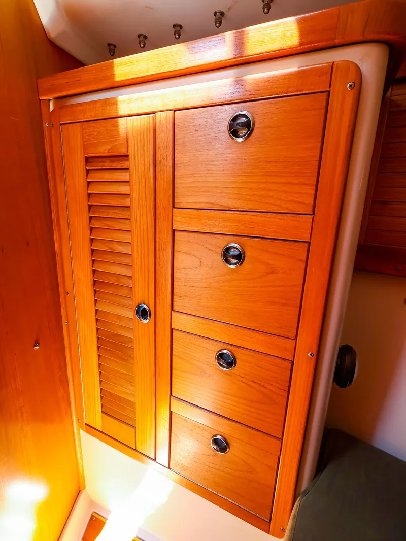 Slide: The Image of Wooden cabinet with drawers in a 2001 Catalina 36 MkII sailboat interior. - 44