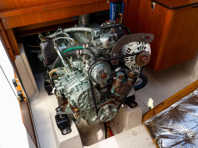 Slide: The Image of Engine of a 2001 Catalina 36 MkII sailboat, showcasing mechanical components and alternator. - 46