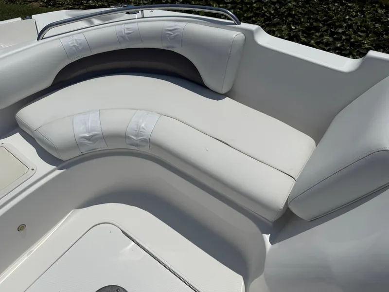 Slide: The Image of 2013 Hurricane SunDeck Sport 188 OB boat interior with white cushioned seating. - 13