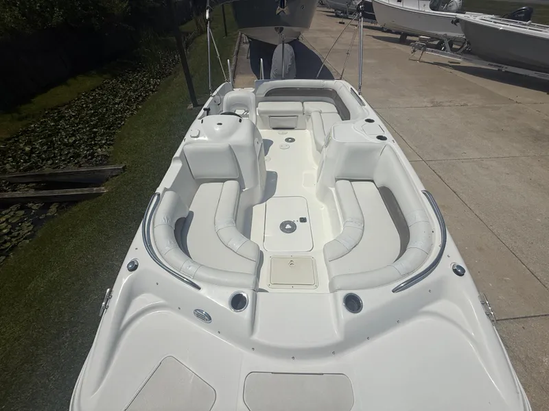 Slide: The Image of 2013 Hurricane SunDeck Sport 188 OB boat with spacious seating and sleek design. - 14