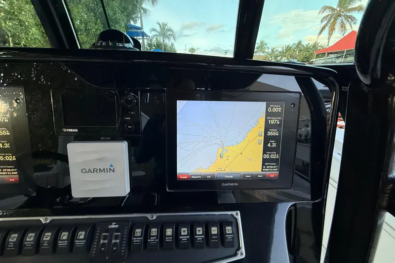 Slide: The Image of Garmin navigation system on 2015 Hydra-Sports 3400 CC boat dashboard. - 58