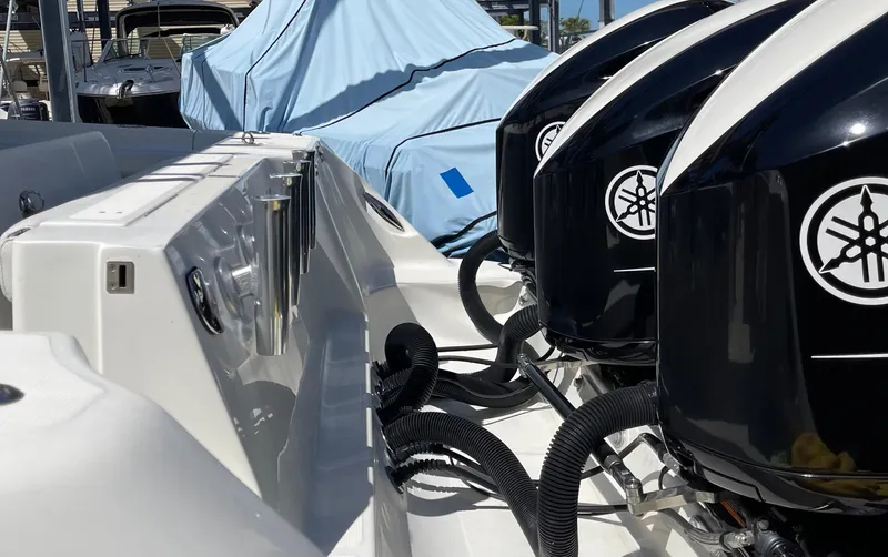 Slide: The Image of Three Yamaha outboard motors on a 2015 Hydra-Sports 3400 Center Console boat. - 6