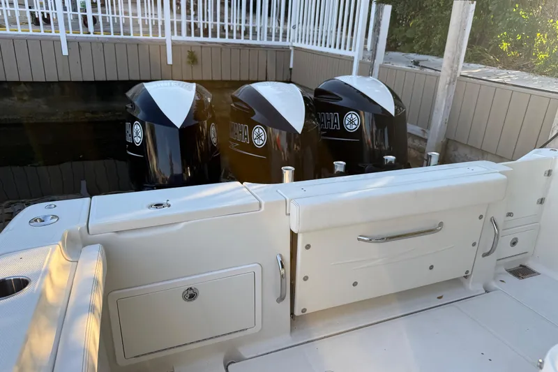 Slide: The Image of 2015 Hydra-Sports 3400 CC boat with triple Yamaha outboard engines docked. - 70