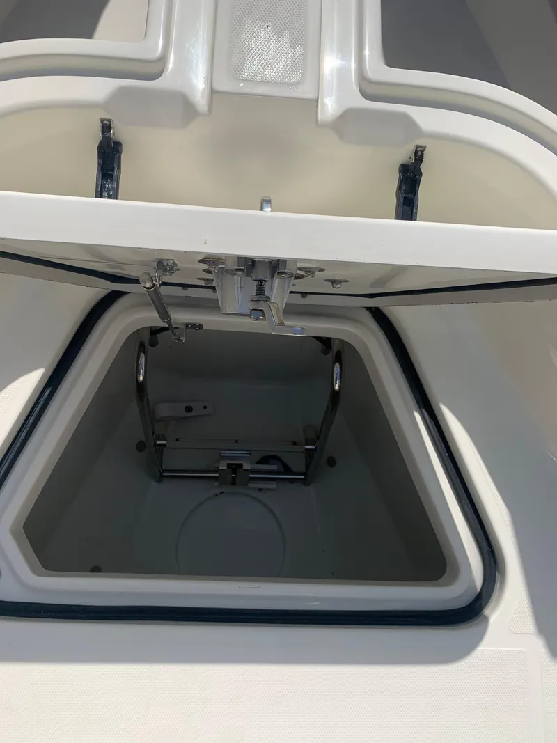 Slide: The Image of Open hatch of 2015 Hydra-Sports 3400 Center Console showing internal components. - 9