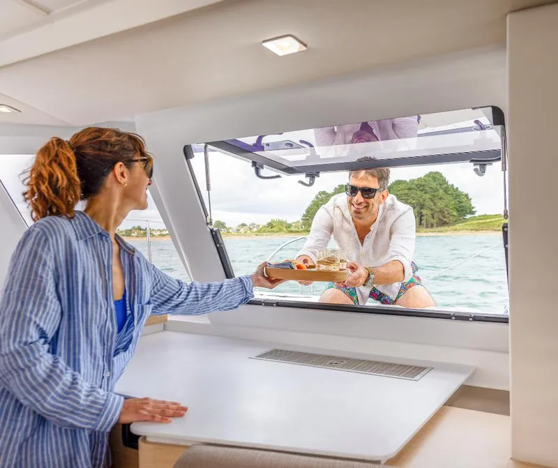 Slide: The Image of Couple enjoying a meal on a 2025 Fountaine Pajot NEW 41 catamaran. - 23
