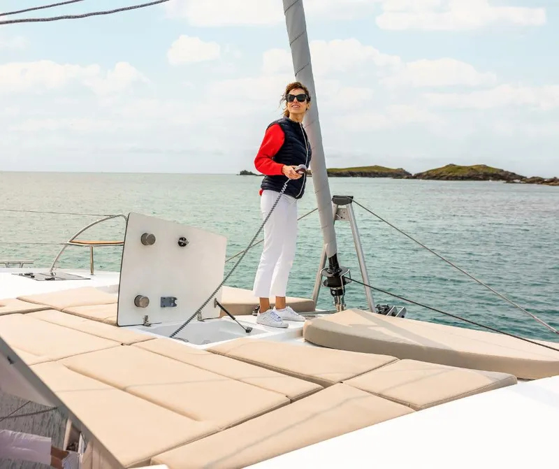 Slide: The Image of Woman enjoying the deck of a 2025 Fountaine Pajot NEW 41 catamaran. - 36