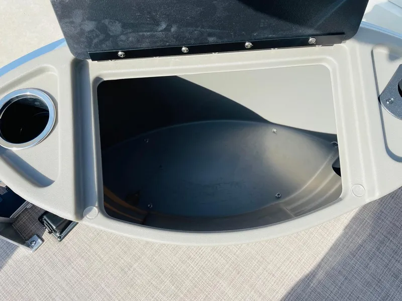 Slide: The Image of Open storage compartment on 2025 Sun Tracker Bass Buggy 18 DLX boat. - 16