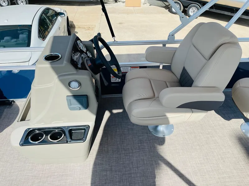 Slide: The Image of 2025 Sun Tracker Bass Buggy 18 DLX boat interior with captain's chair and console. - 17