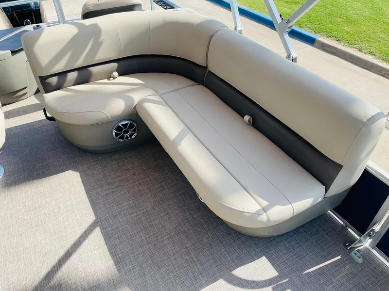 Slide: The Image of 2025 Sun Tracker Bass Buggy 18 DLX pontoon boat seating area with speaker. - 22