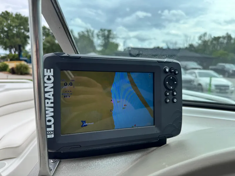 Slide: The Image of Lowrance GPS device on 2004 Crownline 206 LS boat dashboard, displaying navigation map. - 15