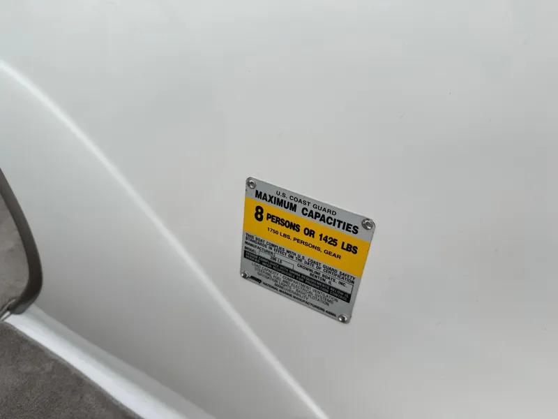 Slide: The Image of 2004 Crownline 206 LS capacity plate, maximum 8 persons or 1425 lbs. - 23