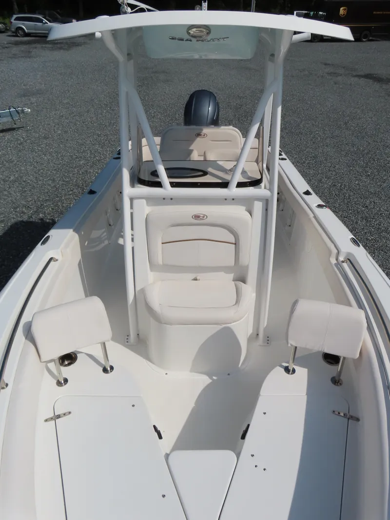 Slide: The Image of 2021 Sea Hunt Ultra 219 boat interior with seating and console. - 14