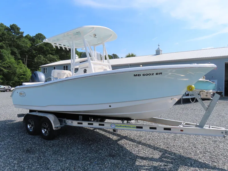 Slide: The Image of 2021 Sea Hunt Ultra 219 boat on trailer, parked outdoors. - 3