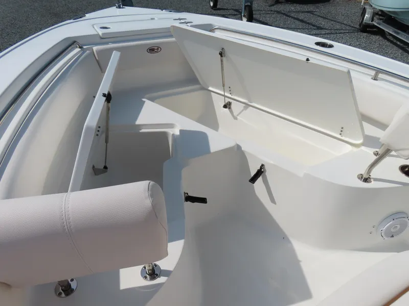 Slide: The Image of 2021 Sea Hunt Ultra 219 boat interior with open storage compartments. - 9