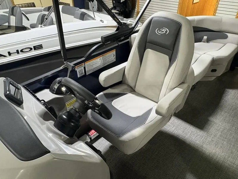 Slide: The Image of Captain's seat of 2025 Barletta A20QC boat, featuring modern design and controls. - 16