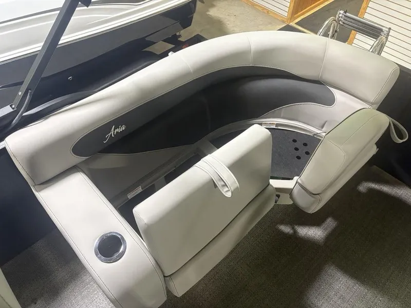 Slide: The Image of 2025 Barletta A20QC boat interior with curved seating and cup holder. - 24