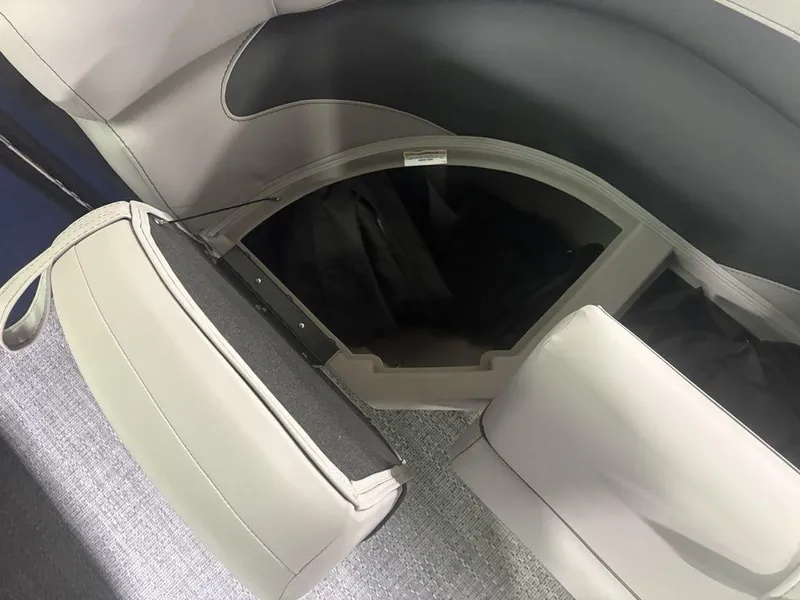 Slide: The Image of Interior storage compartment of 2025 Barletta A20QC boat, featuring sleek seating design. - 25