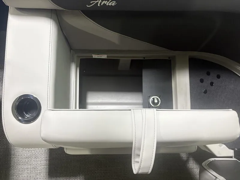 Slide: The Image of Barletta A20QC 2025 boat interior with storage compartment and cup holder. - 26
