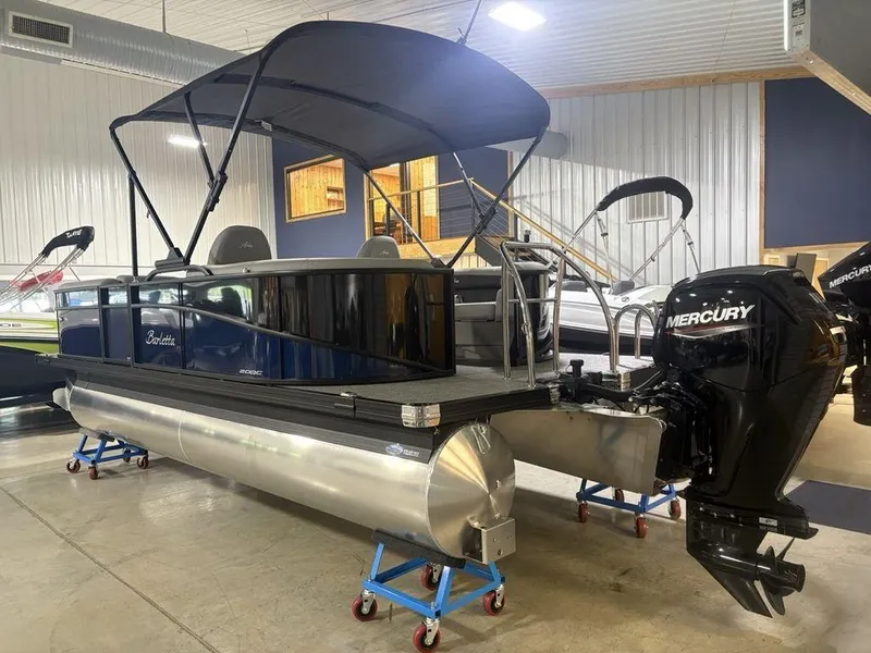 Slide: The Image of 2025 Barletta A20QC pontoon boat with Mercury engine in showroom. - 5