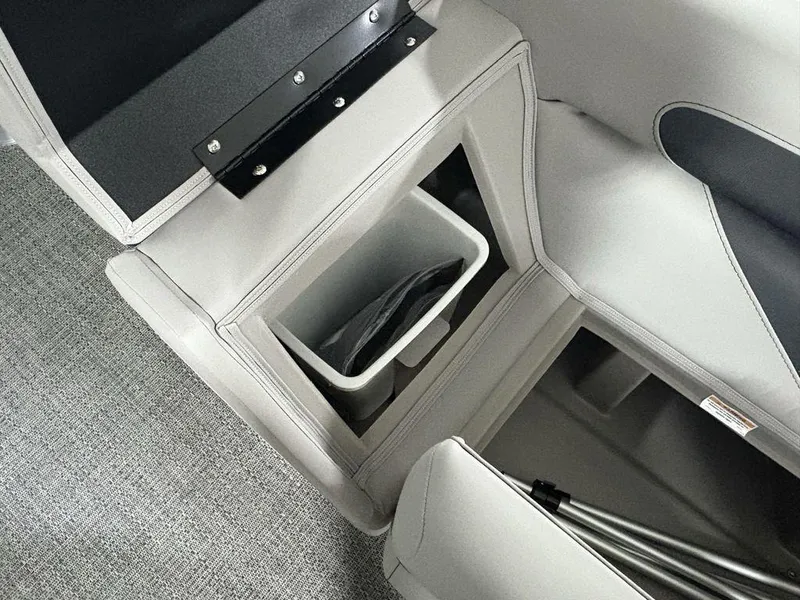 Slide: The Image of 2025 Barletta A20QC interior storage compartment with integrated trash bin. - 6