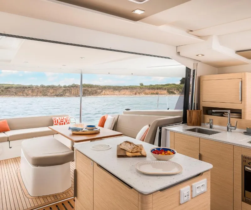 Slide: The Image of Luxurious interior of 2025 Fountaine Pajot NEW 41 catamaran with modern kitchen and seating area. - 8
