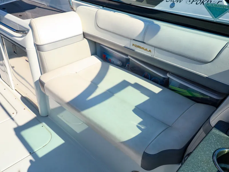 Slide: The Image of 2013 Formula 290 Bowrider interior seating with storage compartments. - 15