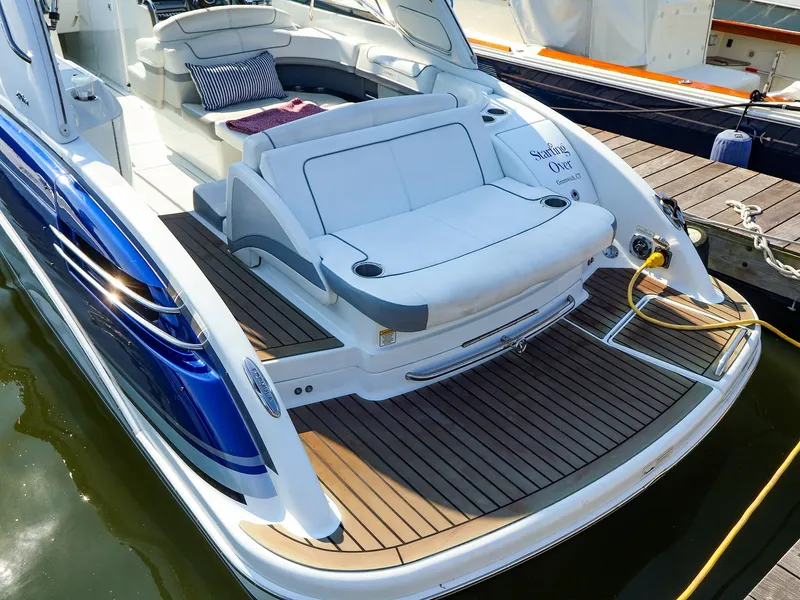 Slide: The Image of 2013 Formula 290 Bowrider boat with spacious seating and elegant design docked at marina. - 6