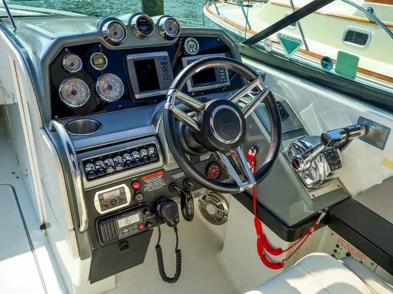 Slide: The Image of 2013 Formula 290 Bowrider dashboard with steering wheel, gauges, and controls. - 8
