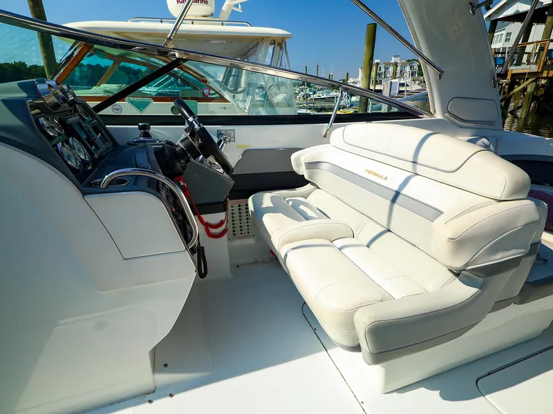 Slide: The Image of 2013 Formula 290 Bowrider interior with steering wheel and plush seating. - 9