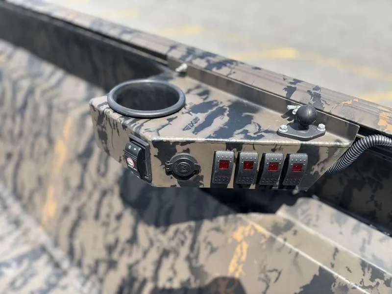 Slide: The Image of 2024 Edge Duck Boats 1756 DIAMONDBACK control panel with camouflage design and switches. - 16