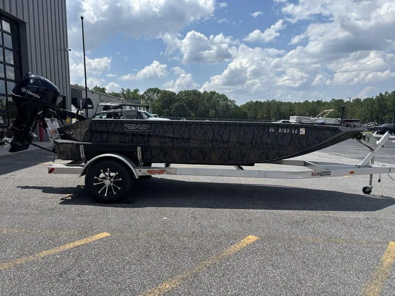 Slide: The Image of 2024 Edge Duck Boats 1756 DIAMONDBACK on trailer, parked outdoors under cloudy sky. - 3